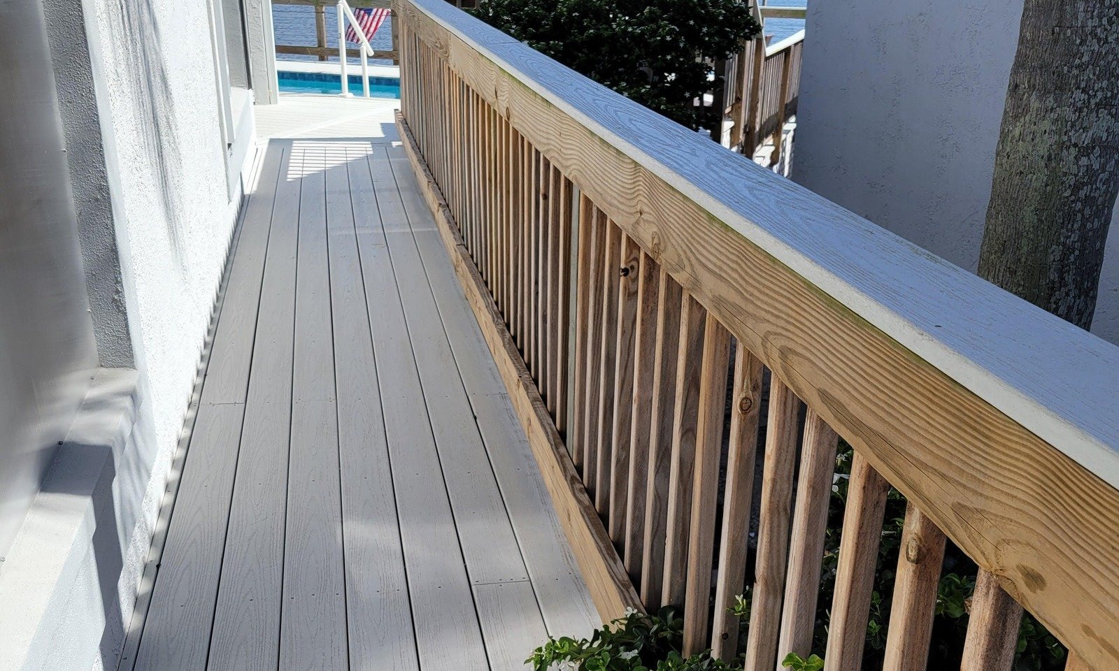 Updated boat dock deck and railing overlooking the water